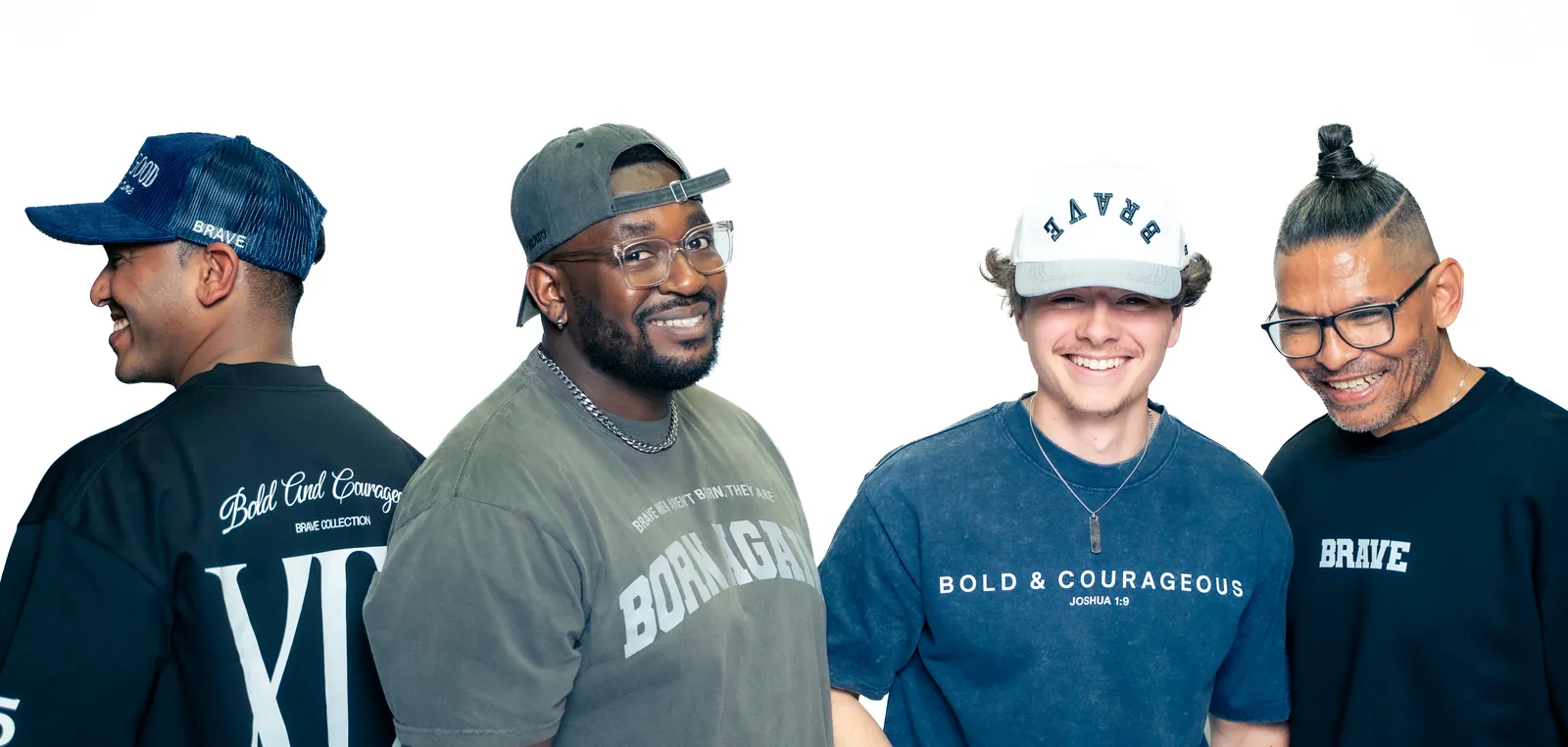 Four men wearing pieces from the Brave collection: the Bold and Courageous crewneck, the Born Again tee and Brave caps